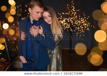 Foto stock: Elegant Couple In Evening Dress Embracing Each Other In Love