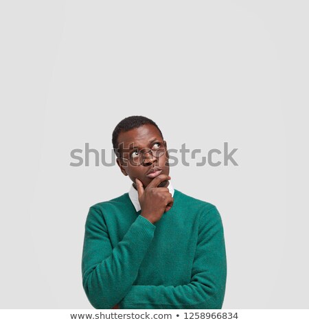 [[stock_photo]]: Portrait A Pensive Young Man Dressed In Sweater