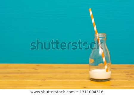 Stock fotó: One Third Pint Glass Bottle With Dregs Of Fresh Milk