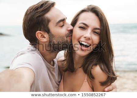 Foto stock: Loving Couple Walking Outdoors While Hugging