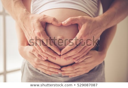 Stock fotó: Cropped Image Of Beautiful Pregnant Woman And Her Handsome Husband Hugging The Tummy