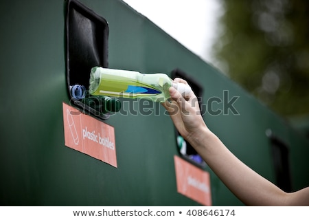 Stok fotoğraf: Young Girl Recycling Plastic Bottles