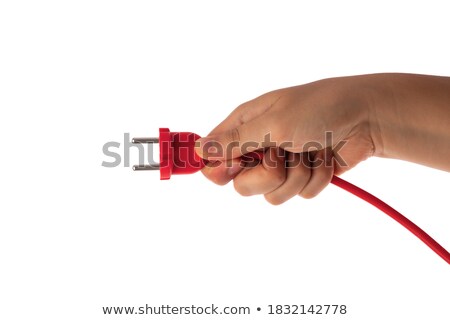 Stock photo: Holding A Red Plug