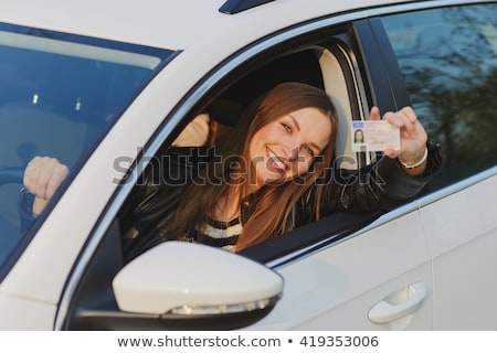 ストックフォト: Young Woman Showing Her Drivers License