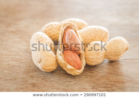 Salted Peanuts On Weathered Wood Stock foto © nalinratphi
