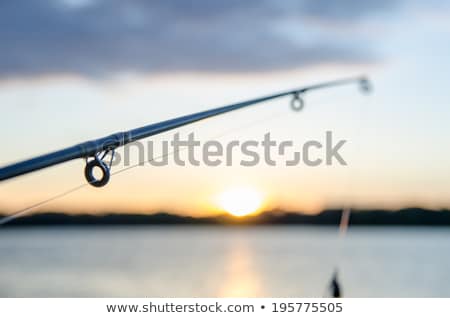 Сток-фото: Fishing On A Lake Before Sunset