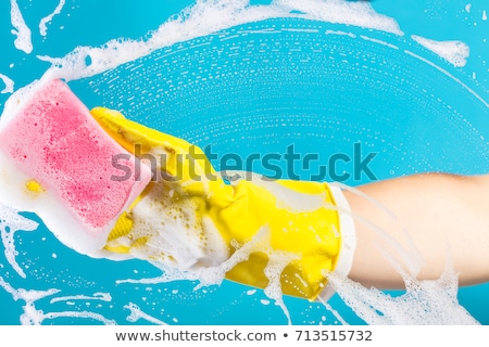 Foto stock: Hand Cleaning Glass Window Pane With Detergent