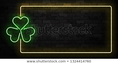 Foto stock: St Patricks Day Neon Sign And Green Brick Wall Realistic Sign