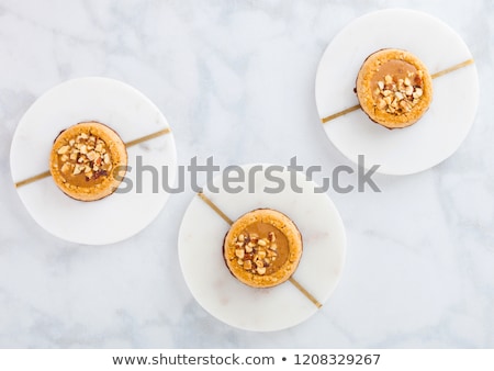 ストックフォト: Homemade Biscuit Cookies With Almond Nuts And Peanut Butter On Marble Coasters On White Kitchen Tabl