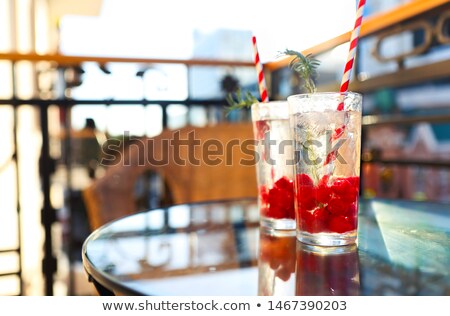 Stok fotoğraf: Summer Refreshing Lemonade With Rasberry On A Balcony Of Terrace