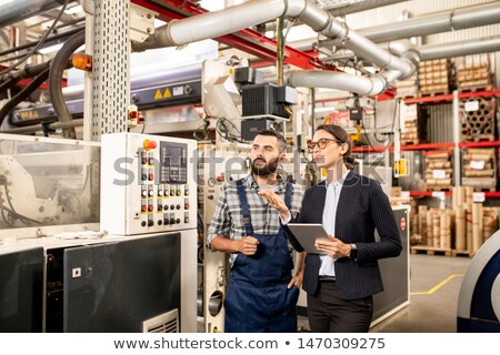 Two Specialists Testing And Discussing New Technology Of Processing Polymers 商業照片 © Pressmaster