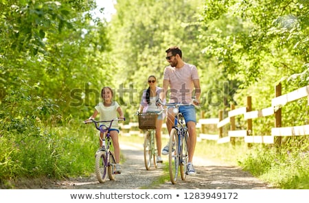 Zdjęcia stock: Happy Family With Bicycles In Summer Park