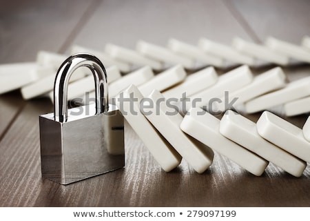 Foto stock: Domino And Lock