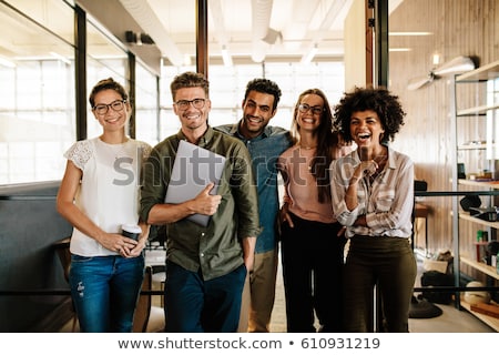 Stockfoto: Smiling Business Team Standing Together At Office