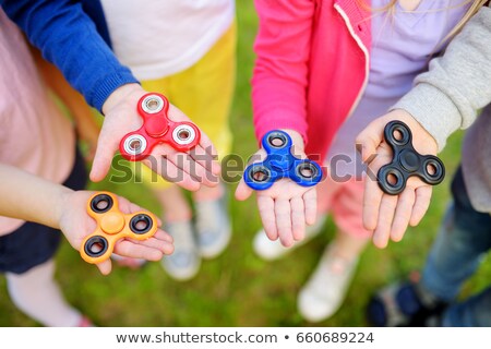 Stockfoto: Girl Playing With Fidget Spinner