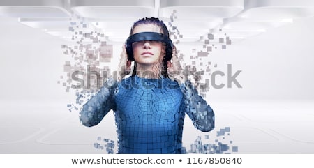 Stockfoto: Digital Composite Of Woman With A Virtual Reality Simulator Against Digital Gray Pixelated 3d Man