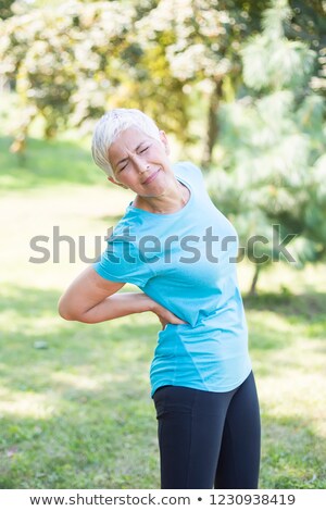 Foto stock: Sporty Senior Woman Having A Back Pain