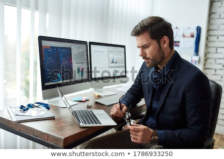 Stock photo: Young Successful Analyst Or Financier Working With Online Data