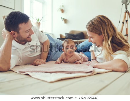 Foto stock: Happy Young Parents With Their Adorable Little Kids At Home