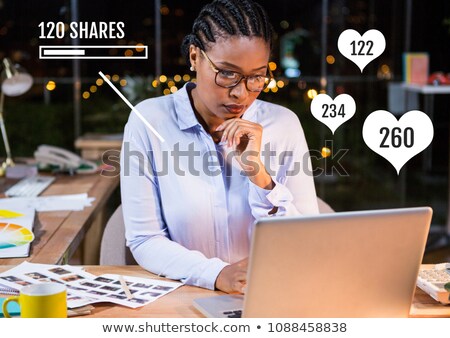 Foto stock: Woman On Laptop With Likes And Shares Status Bars