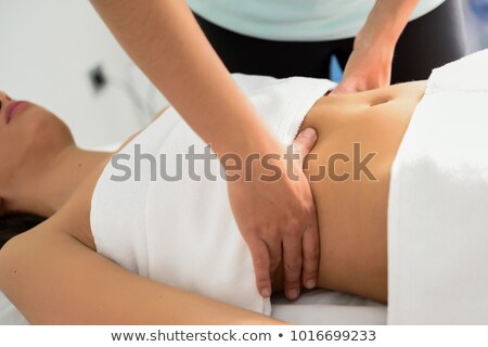 Stockfoto: Beautiful Woman Receiving Massage From Physical Therapist