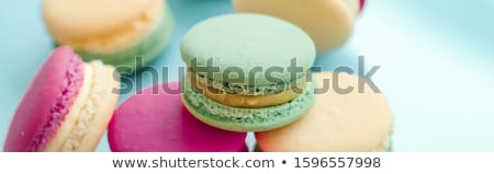 Foto stock: French Macaroons On Blue Background Parisian Chic Cafe Dessert