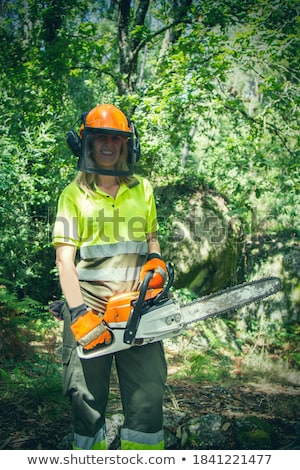 Foto stock: Beauty Woman With Chainsaw