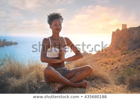 Stok fotoğraf: Woman Doing Yoga On The Beach Sports Landscape