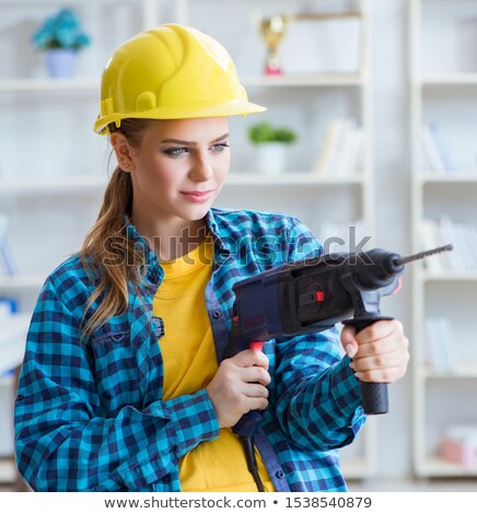 Woman With A Masonry Drill [[stock_photo]] © Elnur