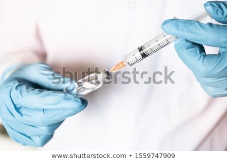 Foto stock: Man Holding Insulin And Syringe