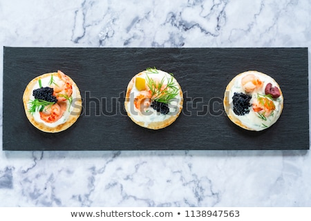 Foto d'archivio: Smoked Salmon Canapes With Sour Cream And Caviar