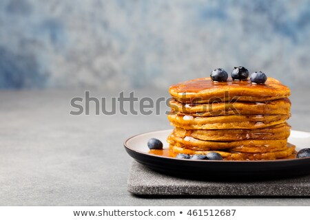 Foto stock: Pumpkin Pancakes With Maple Syrup And Blueberries On A Plate Grey Stone Background Copy Space