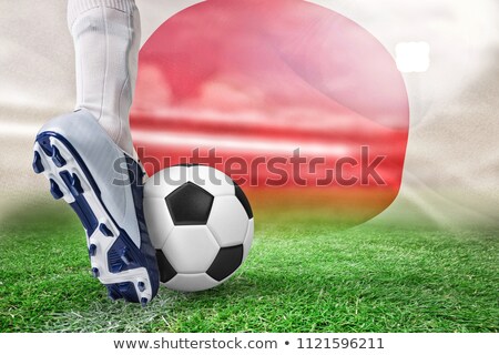 Zdjęcia stock: Close Up Of Football Player Kicking Ball Against Digitally Generated Japanese National Flag