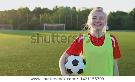 Foto stock: Smiling Teenage Girl With Soccer Ball