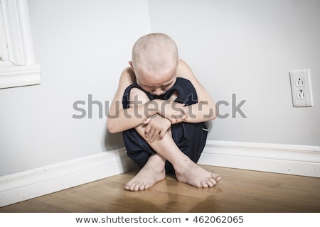 Foto stock: Neglected Lonely Child Leaning At The Wall