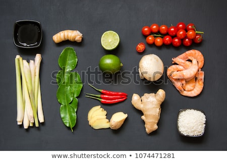 Stock foto: Ingredients For Popular Thai Soup Tom Yum Kung Lime Galangal Red Chili Cherry Tomato Lemongrass