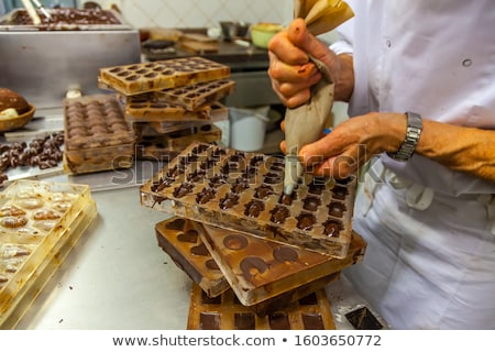 ストックフォト: Confectioner Makes Chocolate Candies At Sweet Shop