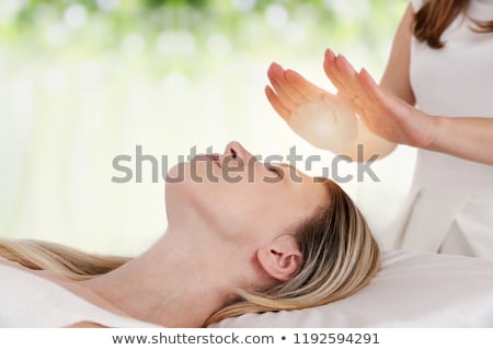 Foto stock: Woman Having Reiki Healing Treatment