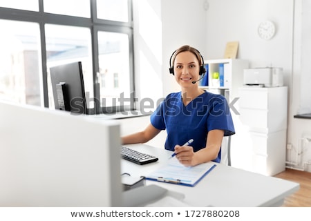 Stock photo: Young Beautiful Female Doctor Working In The Clinic