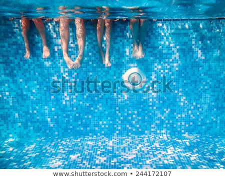 Stock fotó: Legs Of Children In Pool Underwater