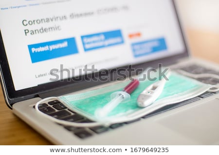 Stock photo: Surgical Ear Loop Mask And Injection Syringe