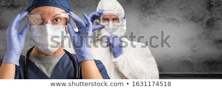 Stock foto: Female Doctor Or Nurse Wearing Scrubs Protective Face Mask And