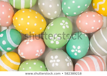 Stok fotoğraf: Pastel Background With Colored Eggs To Celebrate Easter