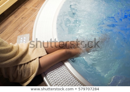 Foto stock: Woman In Jacuzzi