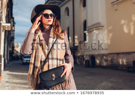 Foto stock: Portrait Of Young Woman Wearing Extravagant Clothes