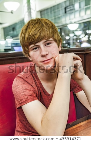 Foto stock: Smiling Boy In A Diners At Night