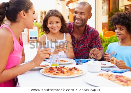 Stock foto: Family On Vacation Eating Outdoors