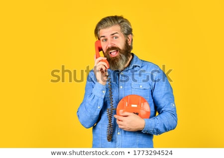 Stockfoto: Man Answering Retro Phone