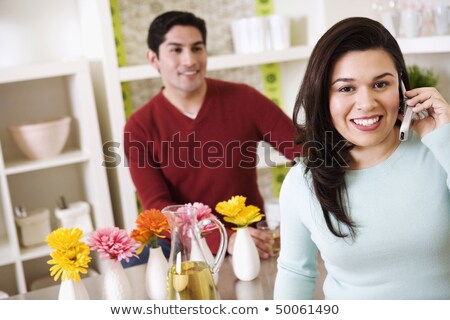 ストックフォト: Man Standing Behind Woman Talking On Phone