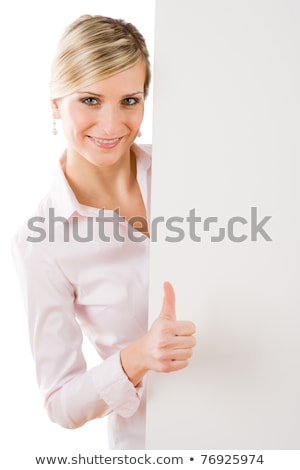 Foto stock: Happy Businesswoman Behind Empty Banner Thumbs Up